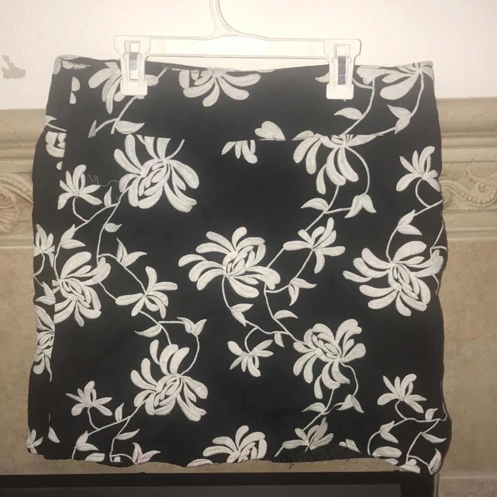 Black skirt with embroidered white flowers